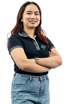 Staff portrait of a digital admin expert in a company uniform posing in a professional workspace.