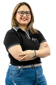 Staff portrait of a team member posing confidently with her arms folded in a modern workspace.