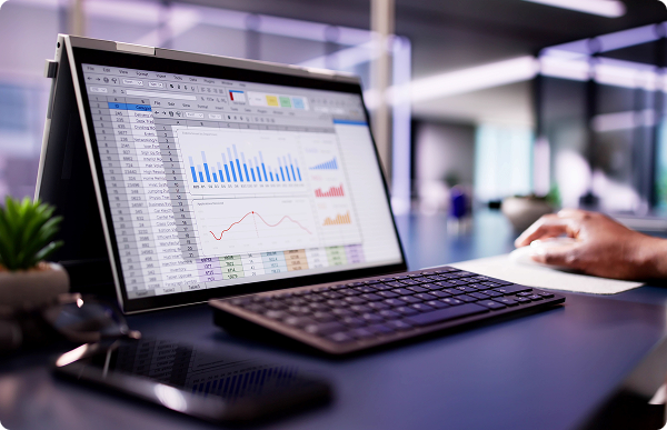 A modern data management setup showing real-time business analytics and financial reporting on a portable workstation.