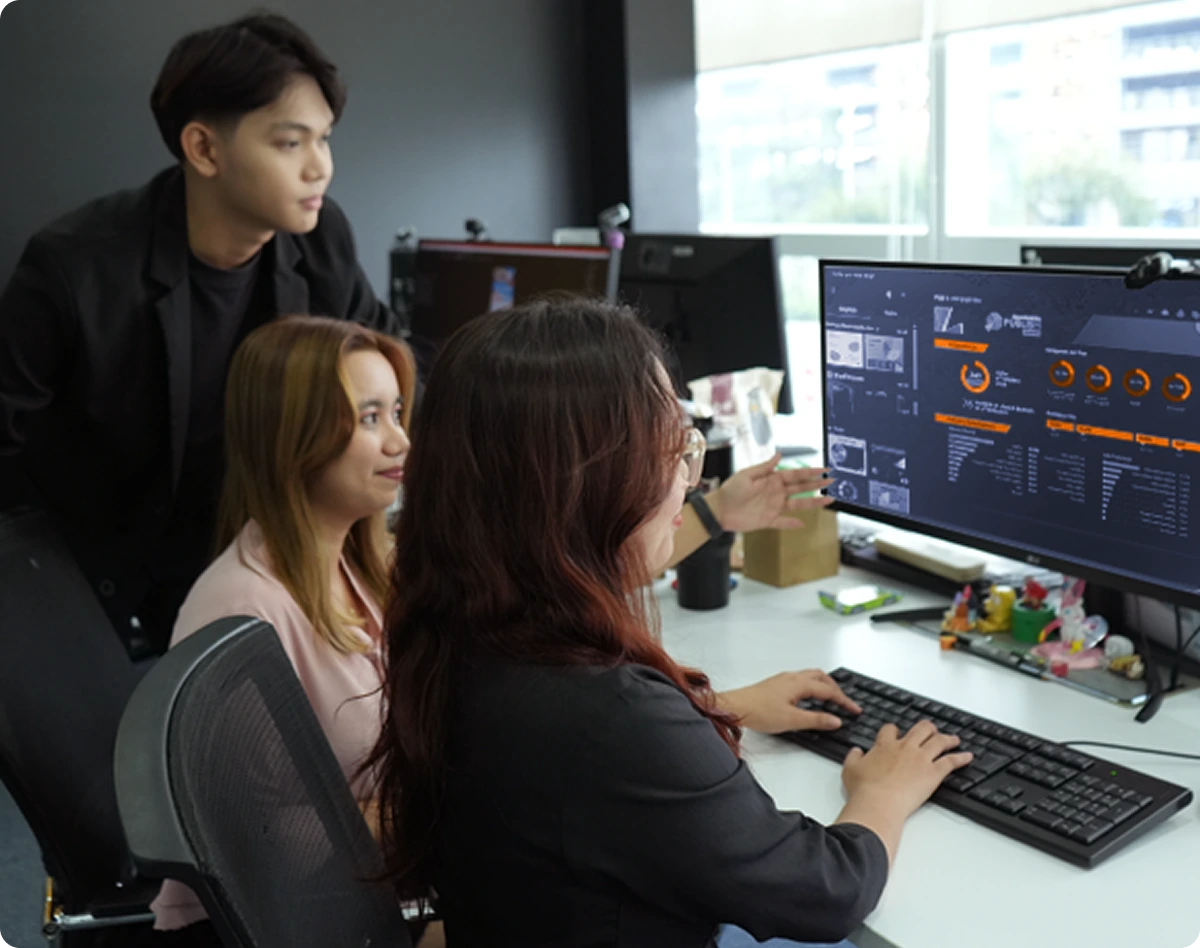A collaborative team session focused on data analysis and performance monitoring in a modern workspace.
