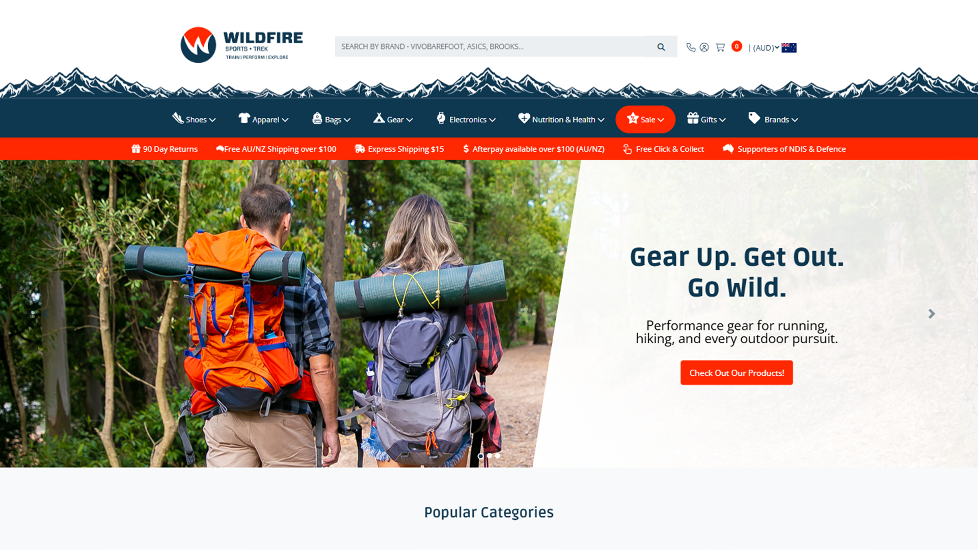 Wildfire Sports & Trek website hero banner featuring hikers with backpacks and the slogan "Gear Up. Get Out. Go Wild."
